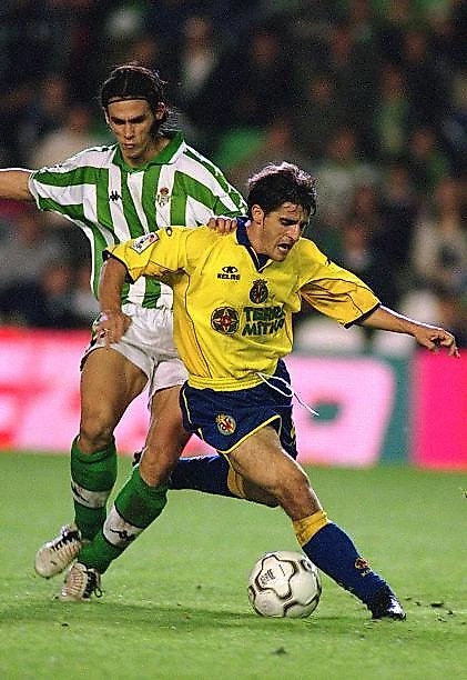 Victor Manuel of Villarreal and Jesus Copi of Betis challenge for the ball during the Primera Liga match between Real Betis and Villarreal played at...