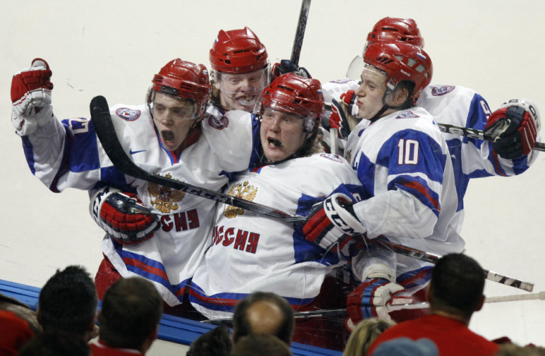 Russia's Artemi Panarin (L) celebrates scoring his teams fourth goal against Canada with teammates Andrei Sergeyev (C) and Vladimir Tarasenko (R) during the third period of their gold medal game at the IIHF World Junior Hockey Championships in Buffalo, New York, January 5, 2011. REUTERS/Mike Cassese (UNITED STATES - Tags: SPORT ICE HOCKEY IMAGES OF THE DAY)
