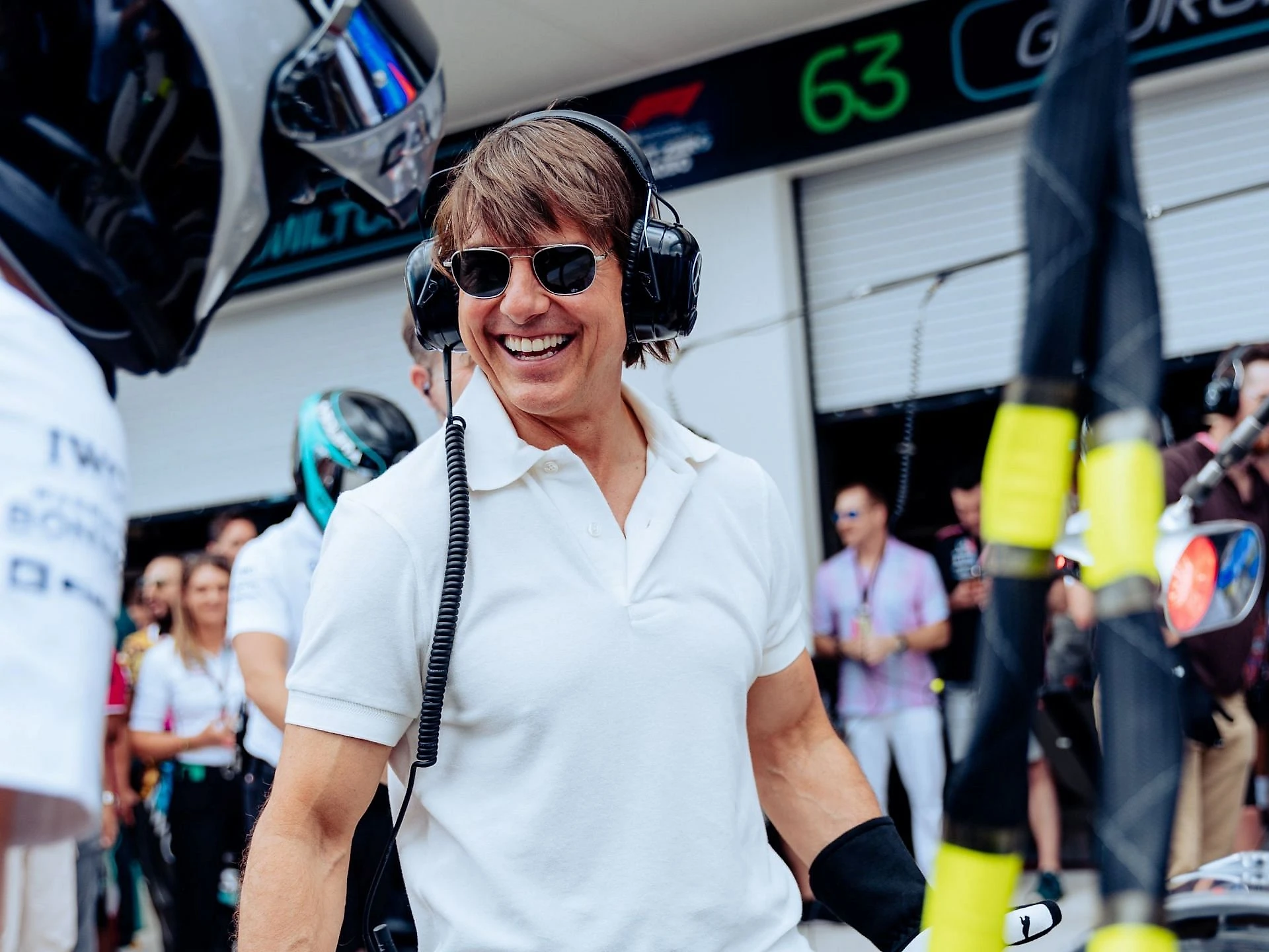 Tom Cruise performs a pit stop as a pit crew at the Mercedes garage prior to the 2023 F1 Miami GP (Image via Twitter/@MercedesAMGF1)