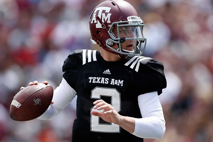 johnny-manziel-signs-so-many-autographs-because-he-got-snubbed-by-tiger-woods-as-a-kid