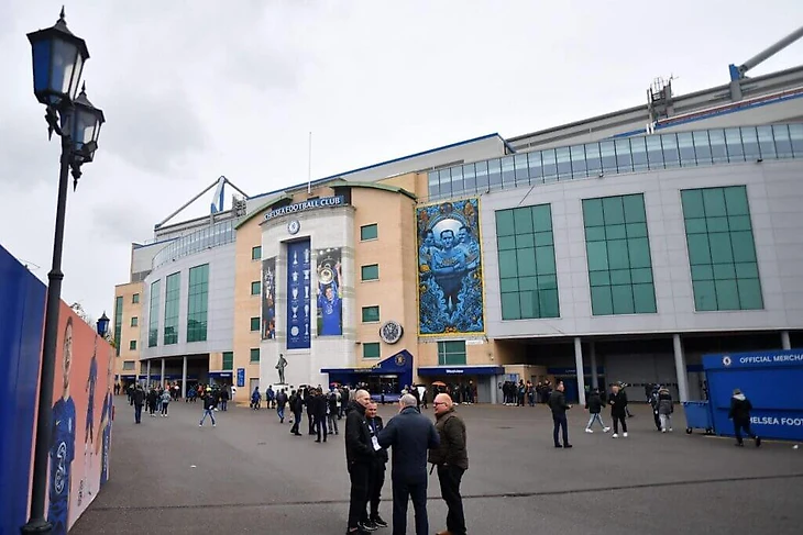 Fans arrive outside Stamford Bridge, the home ground of Chelsea football club, in London on March 13, 2022, ahead of their English Premier League football match against Newcastle United. – Chelsea's Russian owner Roman Abramovich was one of seven more oligarchs sanctioned this week by the UK following Russia's invasion of Ukraine. The European champions have been placed under tough restrictions due to the sanctions on Abramovich. Chelsea are unable to sign players, renew contracts or sell tickets to matches, with limits on the amount of money they are allowed to spend on travel to away games. (Photo by JUSTIN TALLIS / AFP) (Photo by JUSTIN TALLIS/AFP via Getty Images)