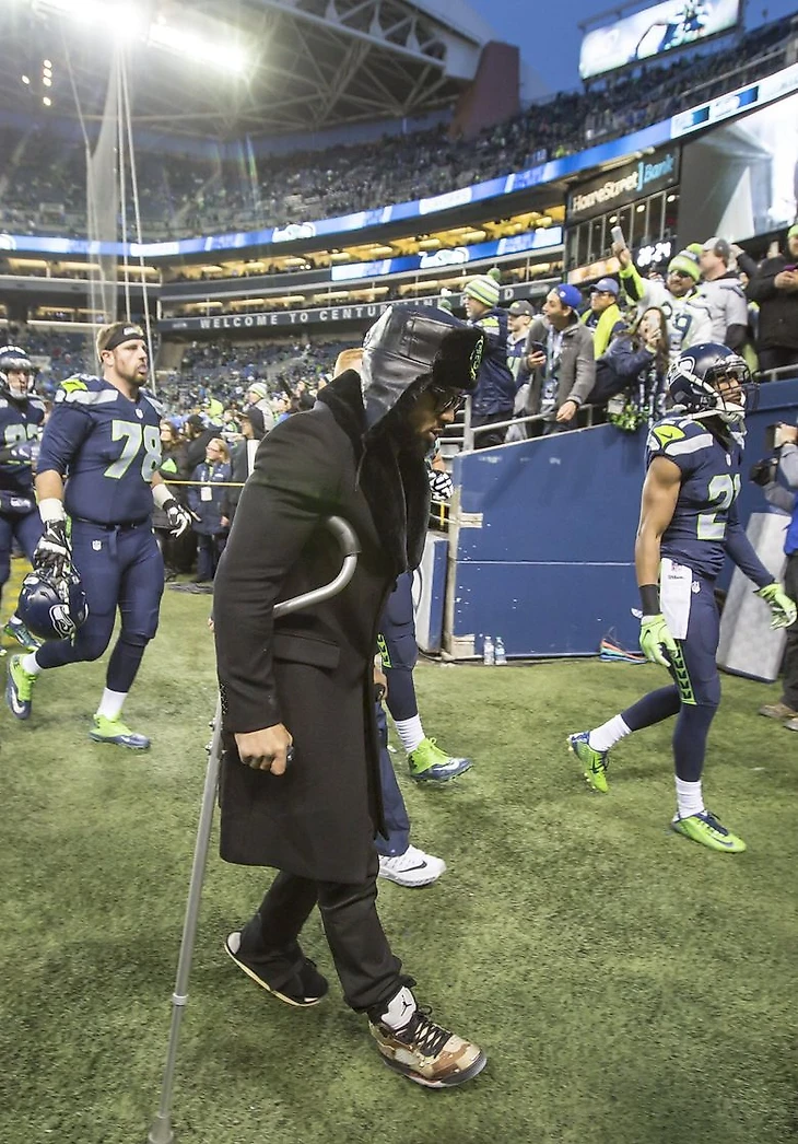 Injured safety Earl Thomas walks into the locker room on crutches before the game as the Seattle Seahawks take on the Detroit Lions Saturday January 7, 2016 for the NFC wild-card playoff game at CenturyLink Field in Seattle.