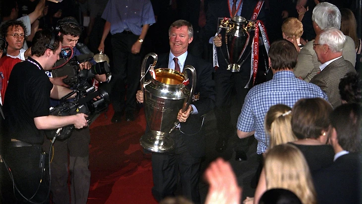 Sir Alex Ferguson shows off the Champions League trophy