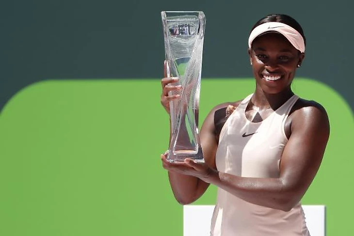 Sloane Stephens of the United States poses with the Butch Buchholz championship trophy after her match against Jelena Ostapenko of Latvia (not pictured) during the women's singles final of the Miami Open at Tennis Center at Crandon Park. Stephens won 7-6(5), 6-1. Photo Credit: Geoff Burke-USA TODAY Sports