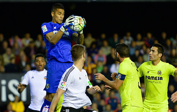 Villarreal's French goalkeeper Alphonse Areola catches the ball during the Spanish league football match Valencia CF vs Villarreal CF at the Mestalla...