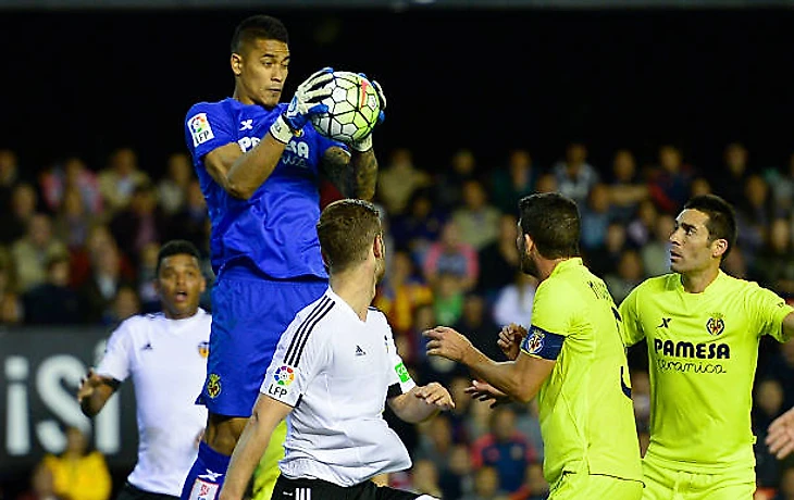 Villarreal's French goalkeeper Alphonse Areola catches the ball during the Spanish league football match Valencia CF vs Villarreal CF at the Mestalla...