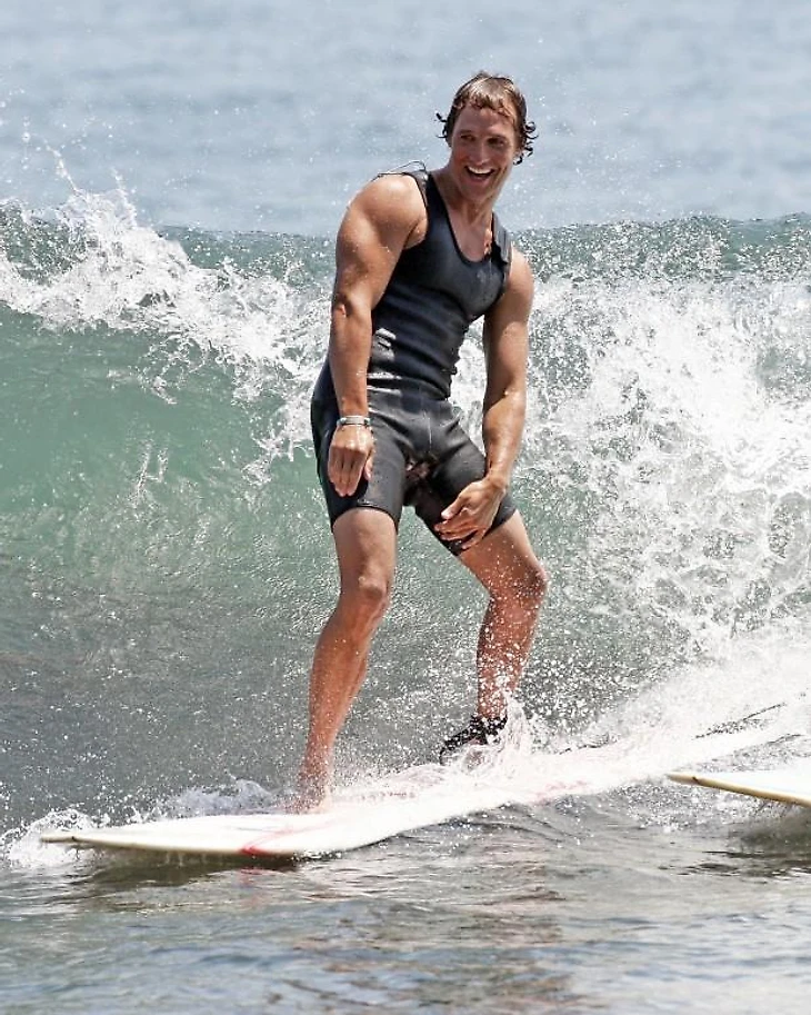 New dad Matthew McConaughey spends a warm Malibu day surfing with friends. Pictured: Matthew McConaughey Ref: SPL44454 160808 Picture by: MAP / Splash News Splash News and Pictures Los Angeles: 310-821-2666 New York: 212-619-2666 London: 870-934-2666 photodesk@splashnews.com