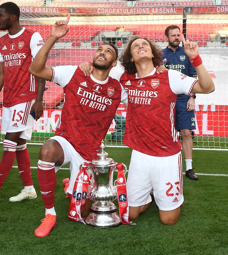 PierreEmerick Aubameyang and David Luiz of Arsenal celebrate after the FA Cup Final match between Arsenal and Chelsea at Wembley Stadium on August 01...