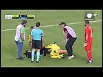 Greek stretcher-bearer falls over and drops injured player twice in farcical scenes
