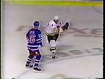 Sergio Momesso stick-swinging at Joey Kocur