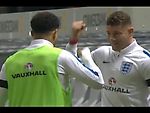 Kyle Walker and Ross Barkley playing rock, paper, scissors at half time