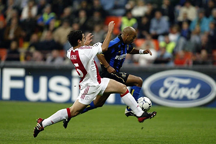 Stephane Dalmat of Inter Milan is tackled by Cristian Chivu of Ajax during the UEFA Champions League Group D match between Inter Milan and Ajax on...