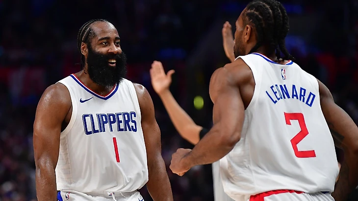 Los Angeles Clippers guard James Harden (1) reacts after forward Kawhi Leonard (2) scores three point basket against the Brooklyn Nets during the second half at Crypto.com Arena.