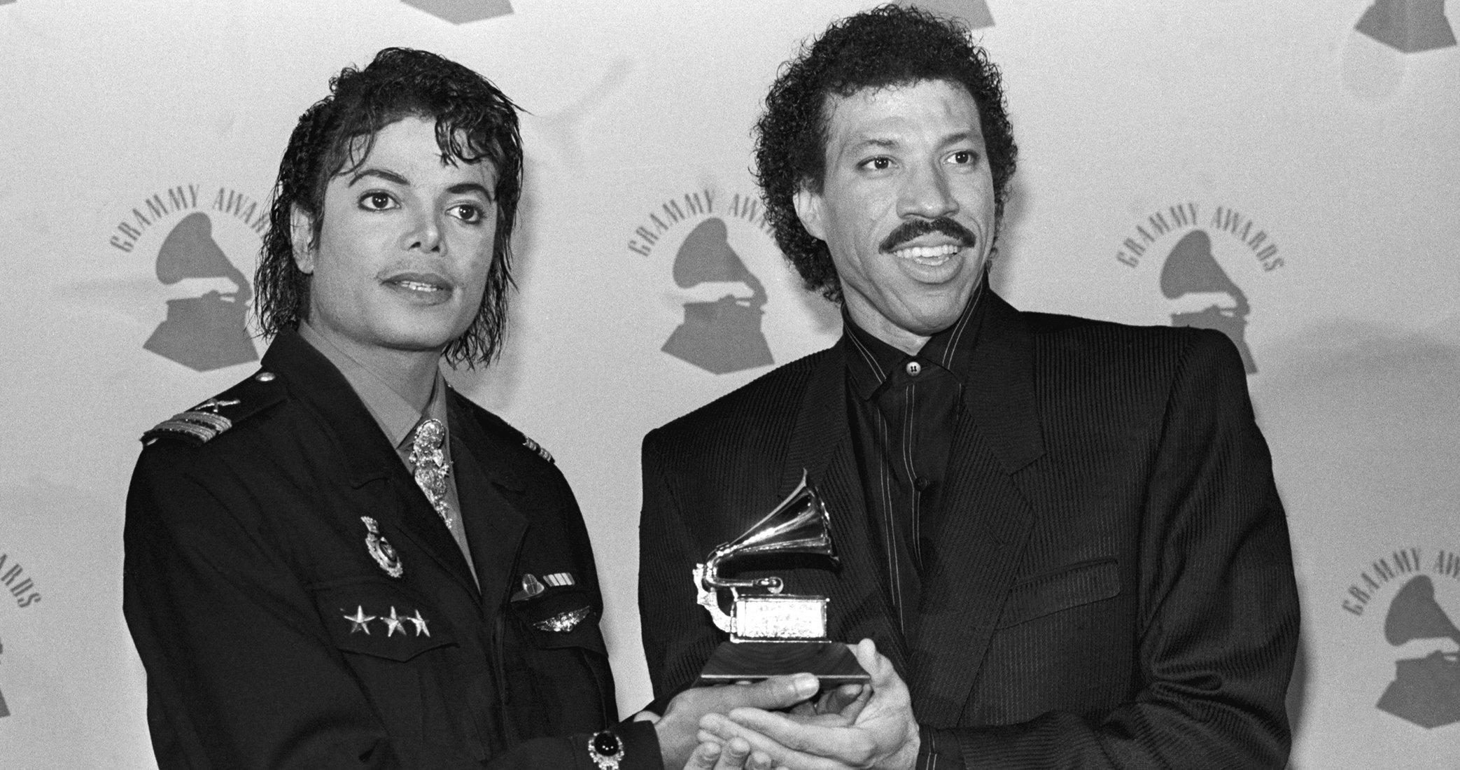 GRAMMY Rewind: Watch Lionel Richie & Michael Jackson Win Song Of The Year For "We Are The World" | GRAMMY.com