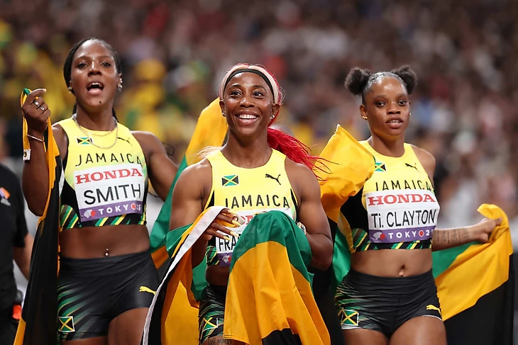 Shelly-Ann Fraser-Pryce celebrates sprint relay silver with her Jamaica teammates
