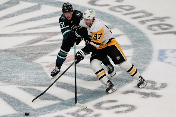 Sidney Crosby and Evgeni Malkin score, Tristan Jarry has 31 saves as Penguins beat Sharks 3-0 | AP News