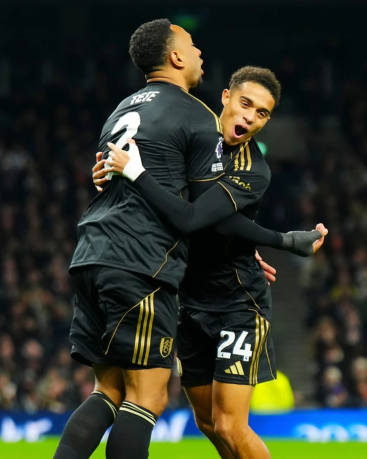 Kenny Tete and Josh King celebrate.